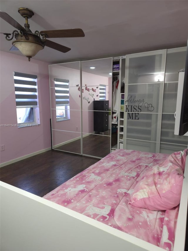 unfurnished bedroom with dark wood-type flooring