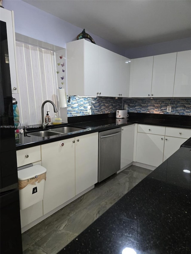 kitchen featuring sink, stainless steel dishwasher, white cabinets, and decorative backsplash