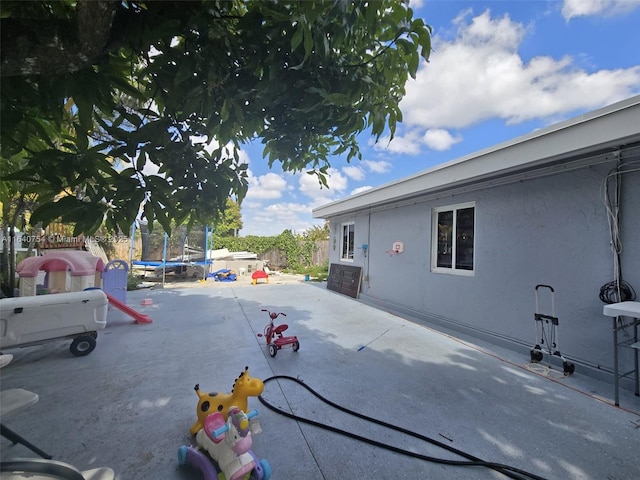 exterior space featuring a patio and a trampoline