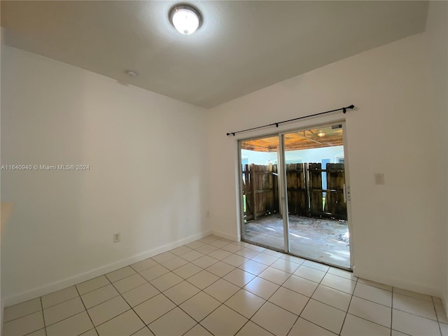 empty room featuring light tile patterned floors