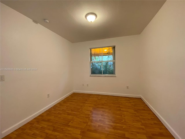 unfurnished room featuring wood-type flooring