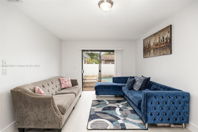 living room featuring a textured ceiling