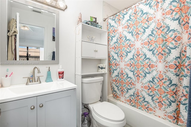 full bathroom featuring vanity, toilet, and shower / tub combo