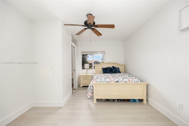 bedroom featuring light wood-type flooring and ceiling fan