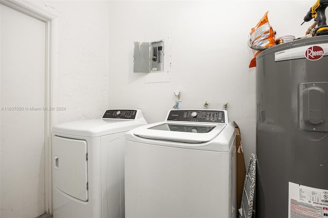 washroom with water heater, electric panel, and separate washer and dryer