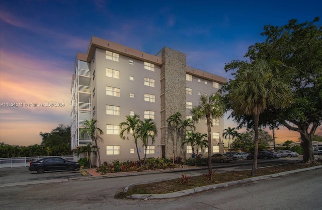 view of outdoor building at dusk