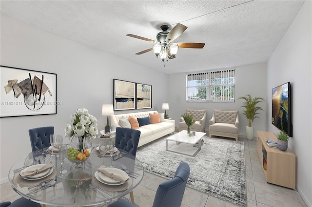 tiled living room featuring ceiling fan and a textured ceiling