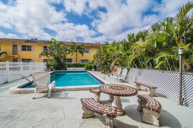 view of swimming pool featuring a patio