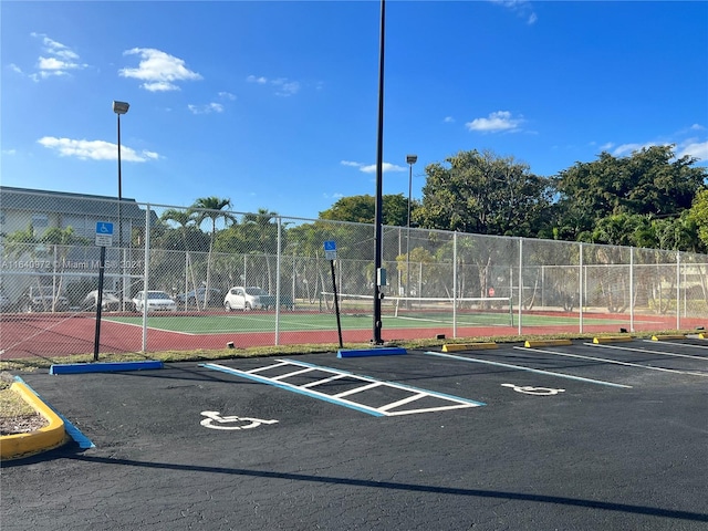 exterior space with tennis court