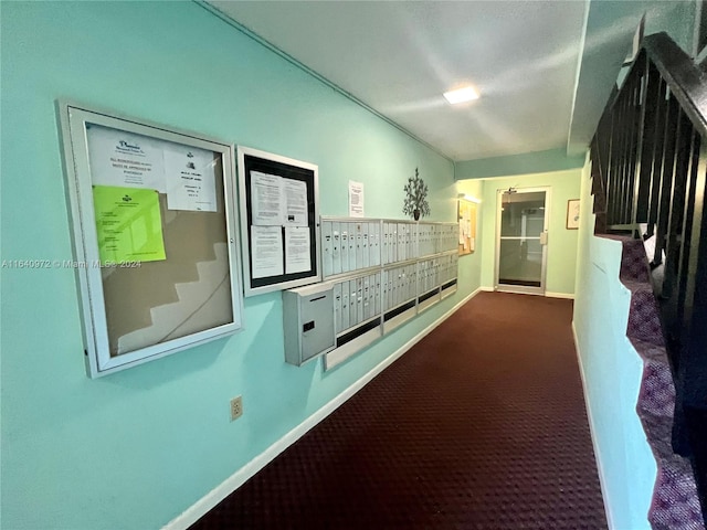 hallway with mail boxes and carpet