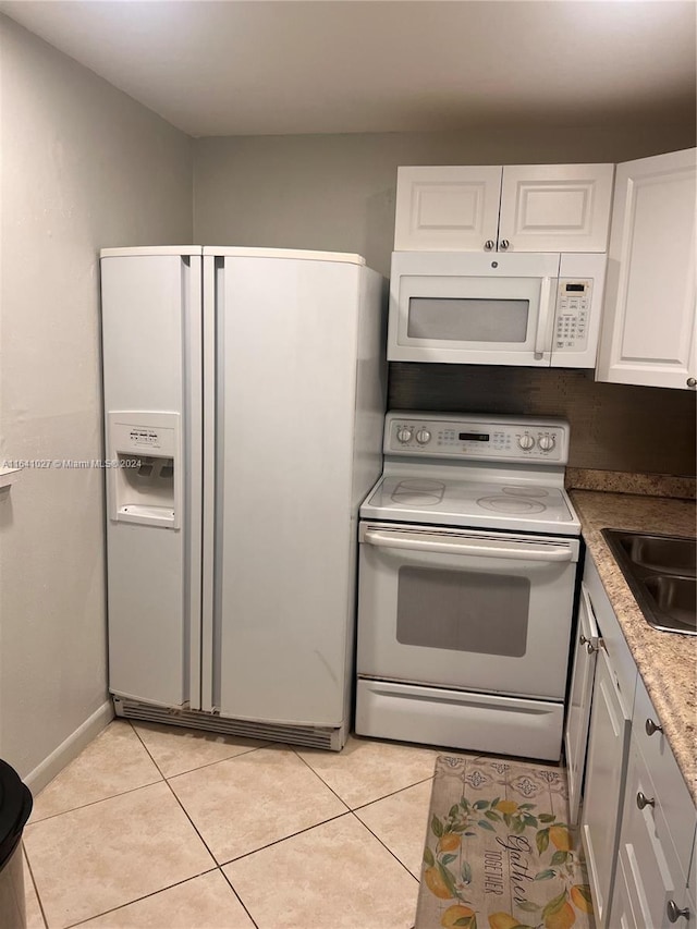 186 Ventnor L Unit 186, Deerfield Beach, FL 33442 - kitchen with white appliances, white cabinetry, light tile patterned floors, and a sink
