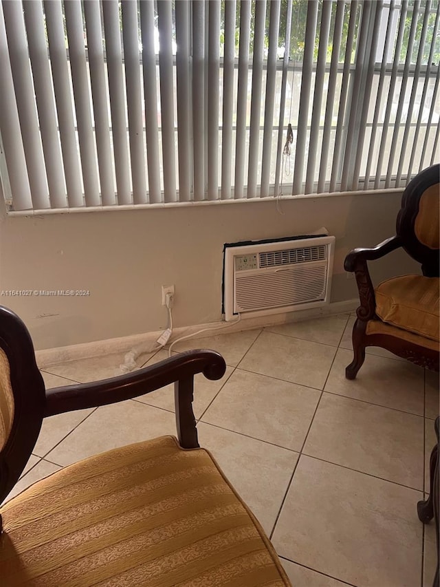 186 Ventnor L Unit 186, Deerfield Beach, FL 33442 - living area with tile patterned floors, an AC wall unit, and baseboards