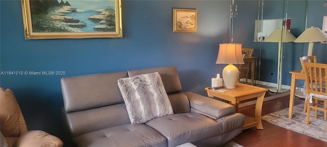 sitting room with hardwood / wood-style flooring