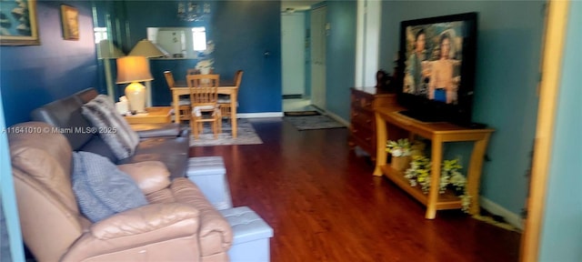 living room with dark hardwood / wood-style floors