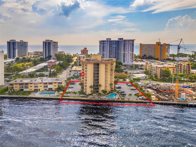 aerial view featuring a view of city and a water view