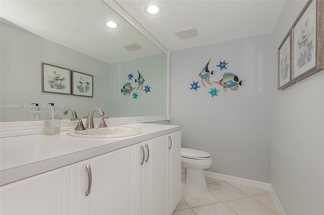 bathroom featuring toilet, tile patterned floors, and vanity