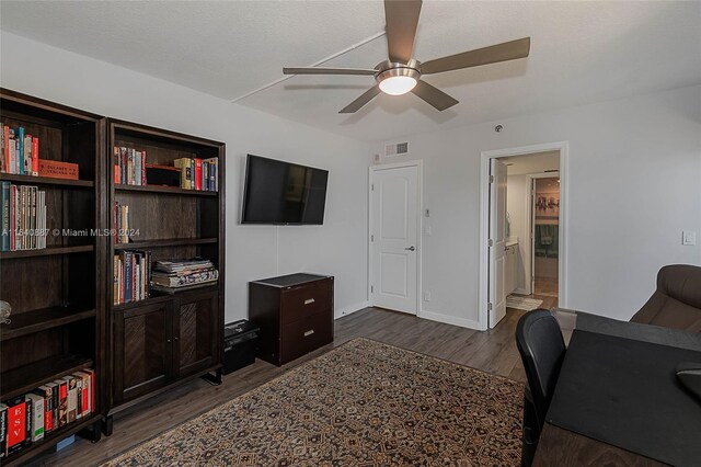 office featuring ceiling fan and dark hardwood / wood-style flooring