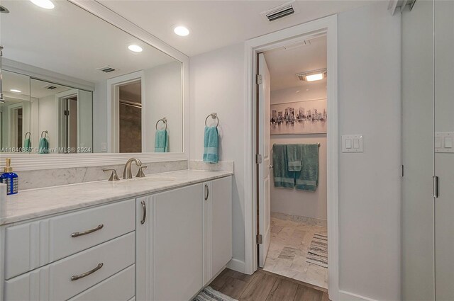 bathroom featuring tile patterned floors and vanity