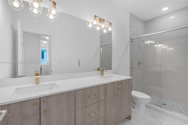 bathroom with tile patterned floors, double sink vanity, a shower with door, and toilet