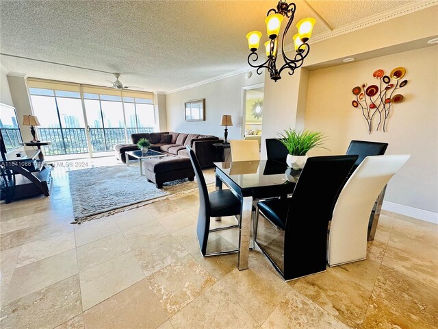 tiled dining area featuring ceiling fan with notable chandelier, a textured ceiling, crown molding, and a wall of windows