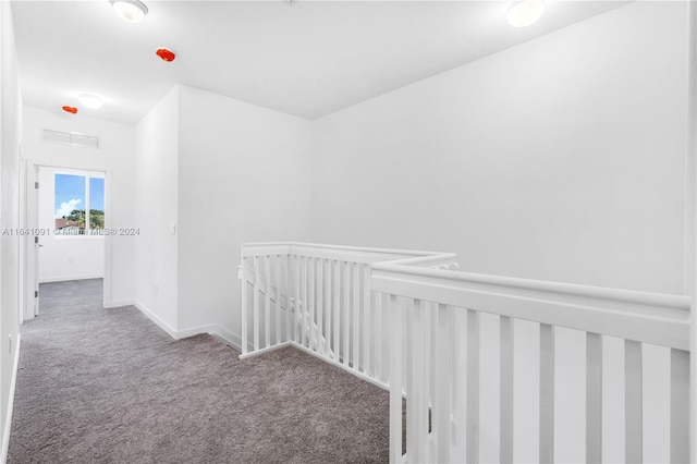 hallway with carpet flooring