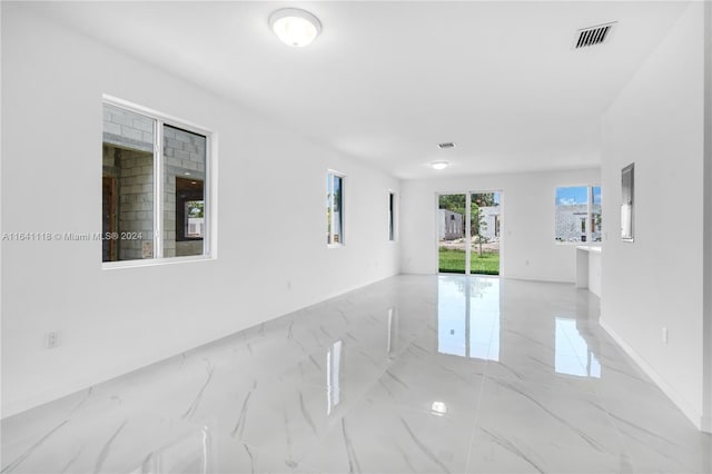 spare room featuring light tile patterned flooring