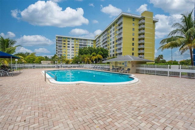 view of swimming pool featuring a patio area