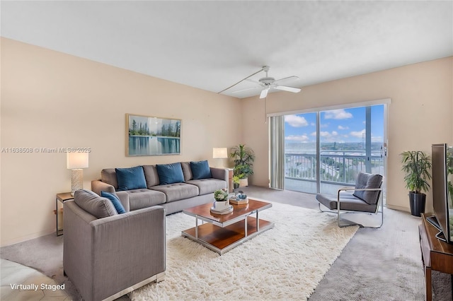 carpeted living room featuring ceiling fan