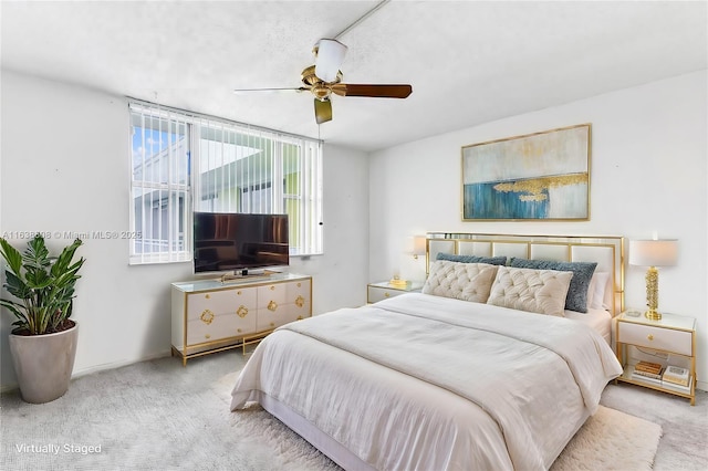 bedroom with light colored carpet and ceiling fan