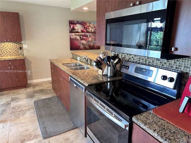 kitchen with tasteful backsplash, light stone countertops, sink, and stainless steel appliances