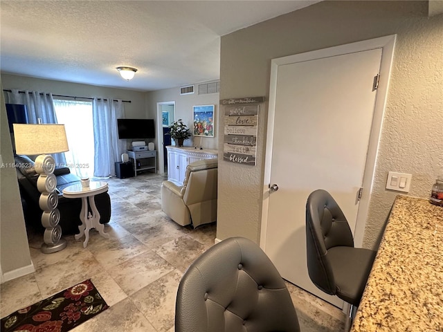 living room with a textured ceiling