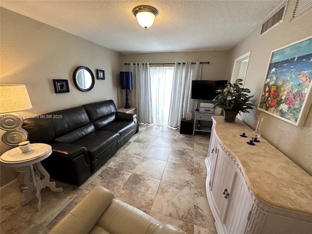 living room with a textured ceiling