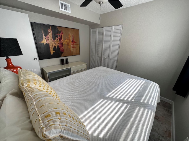 bedroom with carpet flooring, ceiling fan, and a closet