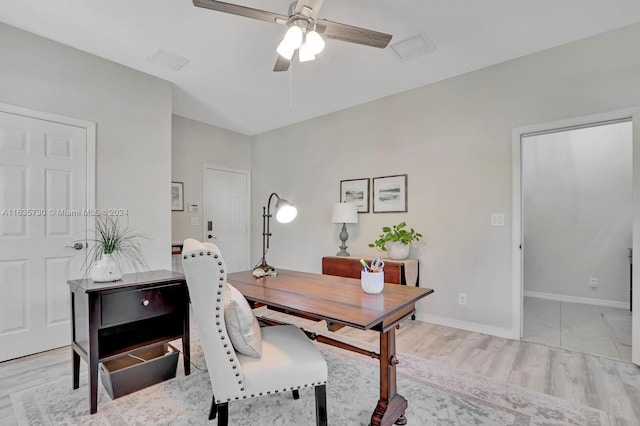 office space with light hardwood / wood-style flooring and ceiling fan