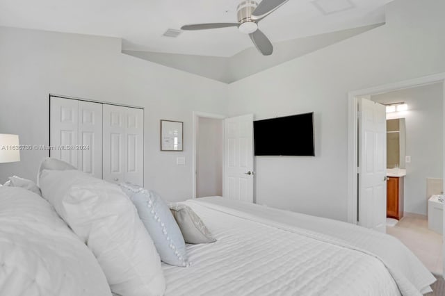 bedroom with connected bathroom, ceiling fan, a closet, vaulted ceiling, and light colored carpet