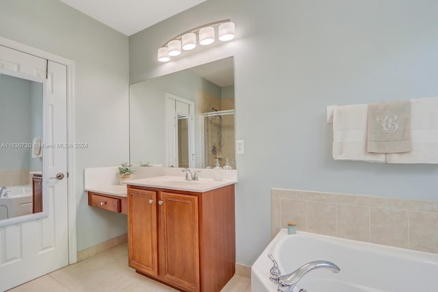 bathroom featuring tile patterned floors, separate shower and tub, and vanity