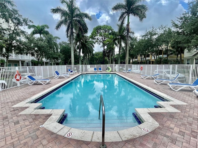 view of swimming pool with a patio