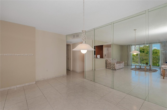 interior space featuring light tile patterned flooring