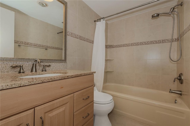 full bathroom featuring vanity, toilet, shower / bath combination with curtain, and tile patterned flooring