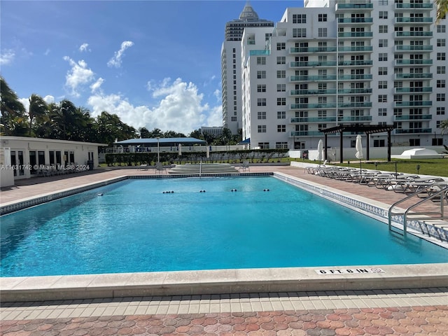 view of swimming pool featuring a patio