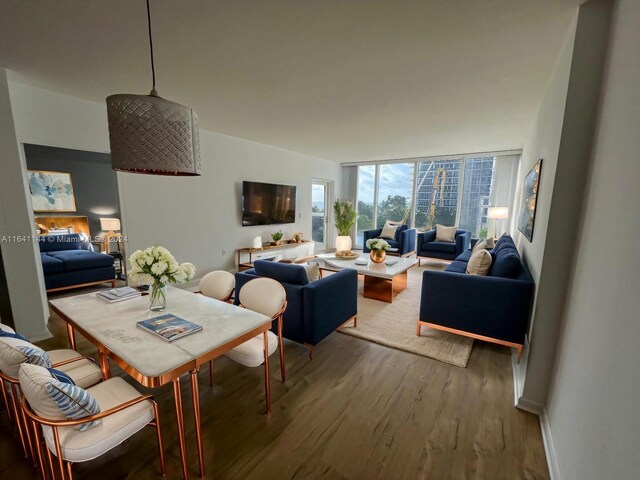 dining space with wood finished floors