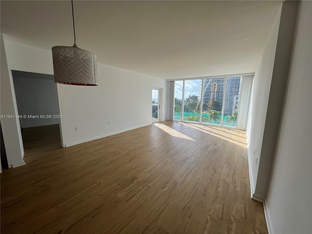 interior space featuring hardwood / wood-style flooring and a wall of windows