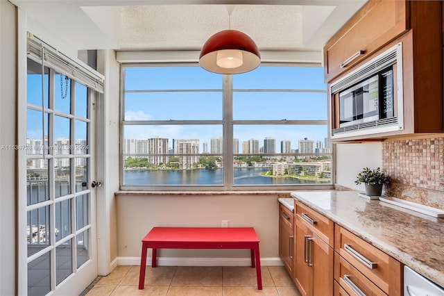 18041 Biscayne Blvd Unit 1404, Aventura, FL 33160 - sunroom / solarium featuring a skyline view and a water view