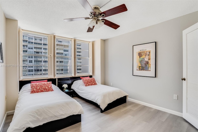 18041 Biscayne Blvd Unit 1404, Aventura, FL 33160 - bedroom with wood finished floors, multiple windows, and ceiling fan