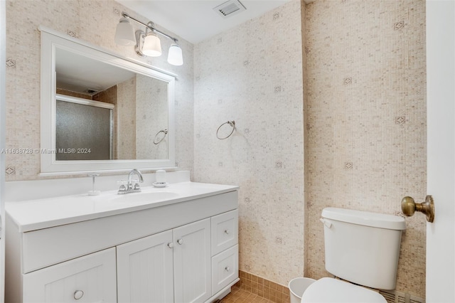 bathroom with tile patterned floors, vanity, and toilet