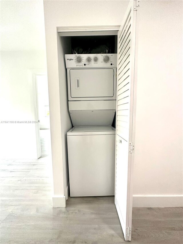 laundry room featuring stacked washer and dryer