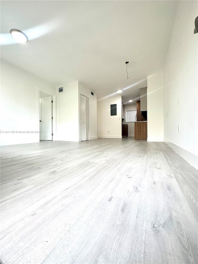 unfurnished living room with light wood-type flooring