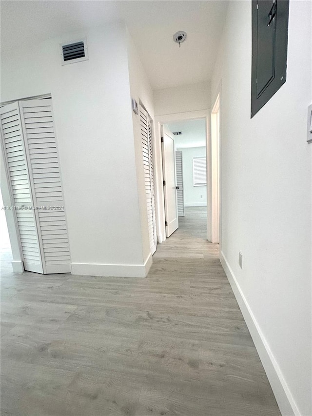 hall with light hardwood / wood-style flooring