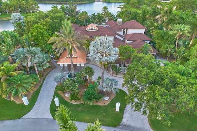 birds eye view of property with a water view