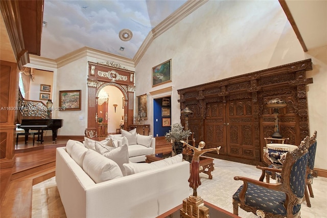 living room featuring high vaulted ceiling